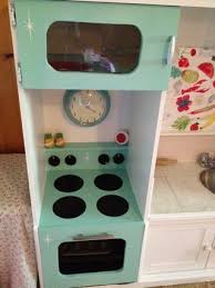 tv stand turned into play kitchen