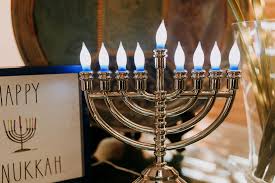 Close-Up Photo Of Candle Holder Beside Sign Board · Free Stock Photo