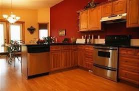 Wanting to paint your oak kitchen cabinets? How To Update Oak Kitchen Without Painting Cabinets Red Kitchen Walls Kitchen Wall Colors Kitchen Colors