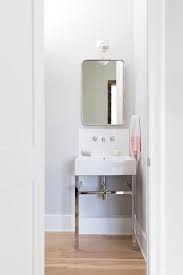 Maybe you would like to learn more about one of these? Small Powder Room Sink Vanity With Pink Hand Towel Transitional Bathroom
