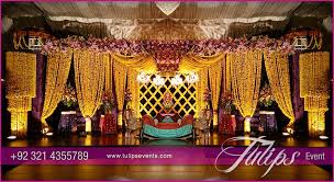 Yellow Drape Mehndi Stage Tulips Event Management Mehndi Stage Stage Decorations Mehndi Stage Decor