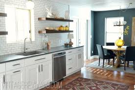 It's also good idea to also have a friend help lift the cabinets while you fasten them to the wall. Alicia S Kitchen Renovation Reveal Kitchen Renovation Home Kitchens Kitchen Remodel