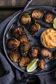 Cut the brussel sprouts in half. Deep Fried Brussels Sprouts With Chipotle Bacon Mayo