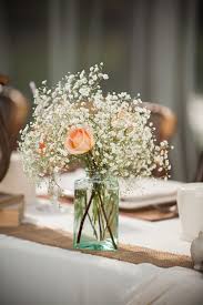 Check out these designs for some major something blue inspiration. Peach Rose And Baby S Breath Centerpiece