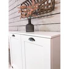 The most common garbage can cabinet material is wood. White Double Tilt Out Trash Cabinet 35 25 In Long X 28 5 In Tall On Sale Overstock 31141947