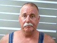 Man arrested after guns, drugs found in home