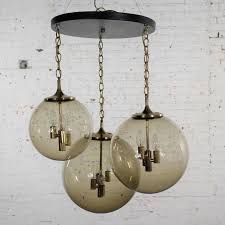 The most common orb ceiling light material is metal. Lightcraft Of California Chandelier With 3 Cascading Smoke Glass Orb Globes For Sale At 1stdibs