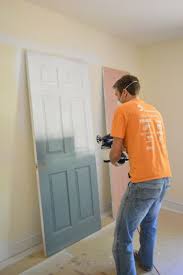 Priming And Painting Our Trim And Doors With A Paint Sprayer Young House Love Young House Love Painting Trim Home Diy
