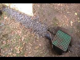 Adding a catch basin to helpp solve a driveway flooding problem. French Drain And Catch Basin In Dirt Driveway Youtube