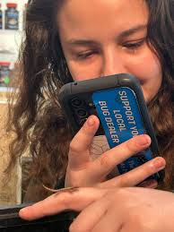 Nicole found a hatchling Mourning Gecko in the small tank that has a  communal pile of eggs.