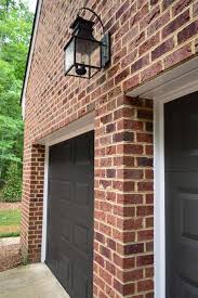 Searching for garage door paints? Wow Check Out This Neat Industrial Garage Door What An Inventive Style Industrialgaragedoor Brick Exterior House House Paint Exterior Red Brick Exteriors