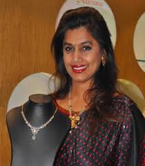 Pinky reddy at rajeev reddy's wedding celebrations in a yellow abu jani and sandeep khosla saree featured with gold kota work over the borders and pallu paired with contrast red benaras blouse. Ek Nazraana Hyderabad Ke Liye