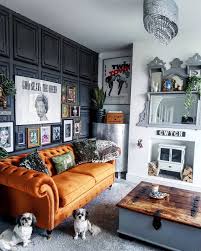 What An Amazing Living Room Love The Burnt Orange Sofa Against The Dark Panelled Wall And Gallery Living Room Orange Living Room Designs Home Interior Design