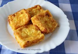 Leche cocida, que se reboza con harina y huevp, y se frie en aceite de girasol, se espolvorea con azúcar y se carameliza. Leche Frita Casera Y Facil La Receta Tradicional Y Casera