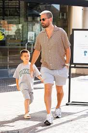 Keeping up with the kardashians. Scott Disick Carries Son Reign On His Shoulders During Shopping Trip With Mystery Brunette Geeky Craze