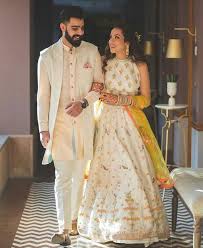 The Mehndi Event Is Most Fun Pre Wedding Ceremony Where The Bride Opts For Colorful Outfits Wedding Dresses Men Indian Indian Wedding Outfits Groom Dress Men