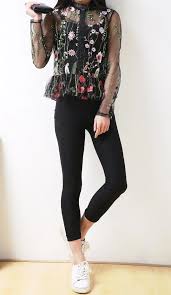 Flowers Sheer Embroidered Top Sleeves flare out below the elbow and tiered layered tulle in the front creates a flowy look.