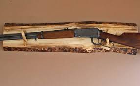Displaying guns on wall as decoration. Gun Wall Display