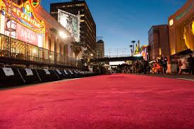 Image captionchrissy metz wore a flowing ruby red dress. The Surprising Bizarre 2 500 Year History Of The Oscars Red Carpet Vox
