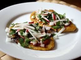Huaraches are a popular mexican street food, where masa flour dough is prepared in an oblong shape and topped with salsa, onions, tomato, lettuce, and your choice of protein. Dinner Tonight Huaraches With Black Beans And Radish Recipe Serious Eats