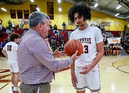 Whitehall's AJ Hines (23) muscles his way against William Allen to score  his 1000th career point