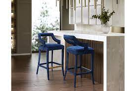 Get yourself a luxurious navy blue bar stool set with gold plated and slender legs for a sleek look in your kitchen! Tiffany Counter Height Bar Stool Ashley Furniture Homestore