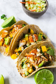 Rub tilapia fillets with 2 tablespoons lime juice and season with salt, black pepper, garlic powder, and paprika. Fish Tacos With Cod And Mango Salsa Fishrecipes Fishtank Recipes Health Healthyrecipes H Fish Recipes Healthy Fish Tacos Mango Salsa Mango Salsa Recipes