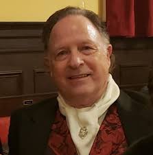 Why does light travel at 186,000 m/s in a vacuum?