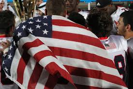 A player from Team USA wraps himself up in the American