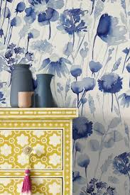 A Beautiful Wallpaper Design Featuring Herbaceous Flowers And Botanical Stems Shown Here Blue Floral Wallpaper Vintage Flowers Wallpaper Grey Floral Wallpaper