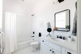 Modern bathroom with marble vanity and marble herringbone floors. Black And White Bathroom With Matte Black Finishes Hgtv