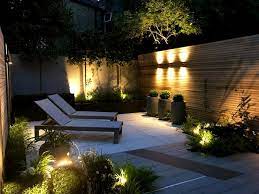 Our vast selection makes lighting outdoor areas easy! Clapton Garden Design Cat Howard Garden Lighting Design Backyard Lighting Landscape Lighting Design