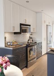 Gray kitchen cabinets & white countertops. Trending Dark Lower Kitchen Cabinets The Decorologist