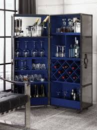 By adding a glass window and beautiful wooden shelves, the steamer trunk bars are transformed. Invest In Grand Act Of Hospitality