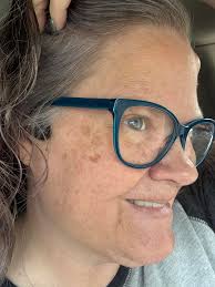 This is actually an indentation in the asphalt. Has water in it so it  appears darker.