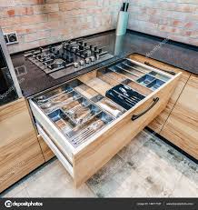 modern kitchen. opened drawers and