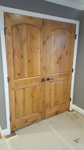 Knotty Alder Doors With Minwax Golden Pecan And Sherwin William Dovetail Gray Walls Meet Knotty Alder Doors Alder Wood Stained Doors