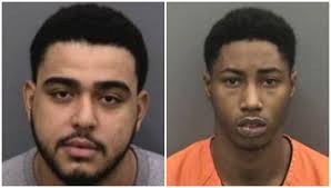 Robbers barged in. One was shot dead. Now the other is charged with murder.