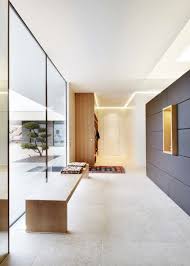Modernes Wohnhaus Im Bezirk Grieskirchen By Josko Manufacturer References Travertine Floors Living Room Foyer Flooring Floor To Ceiling Windows
