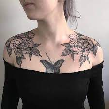 This tattoo consists of three small and colorful butterflies along with the name jonathan. Womens Butterfly Chest Tattoos Novocom Top