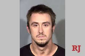 Man charged with fire bombing a Las Vegas apartment