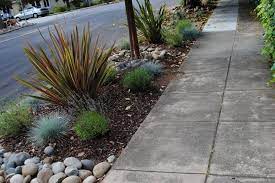 Design ideas for a contemporary partial sun side yard river rock lawn edging in other. How To Use Rocks In Your Landscape 18 Ideas For Landscaping With Rocks Hgtv
