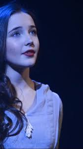 Who is the singer at the Russell's home?