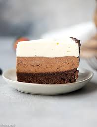 A Slice Of Triple Chocolate Mousse Cake On A Small Plate With Layers Made With Three Different Chocolate Mousse Cake Mousse Cake Triple Chocolate Mousse Cake