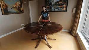 When you rotate the expanding circular dining table, its six segments that make up. A Clever Circular Table That Expands To Twice Its Size With A Simple Turn Of The Tabletop