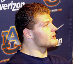 Auburn linebacker Jake Holland plans to donate long locks to charity