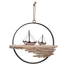 Play with different shades of blue in your bedroom design. Wooden Sailboat Wall Decor Wayfair