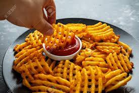 That's right, i skipped the frying for a waffle iron—less fat and way better tasting. Crispy Potato Waffles Fries With Ketchup In A Black Plate Stock Photo Picture And Royalty Free Image Image 105385058