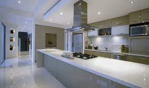 Huge, long modern kitchen with a mirror as a backsplash which makes the already large space look bigger. Top 70 Best Modern Kitchen Design Ideas Chef Driven Interiors