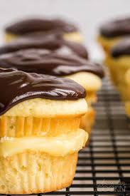 Two layers of yellow cake are filled with pastry cream and topped off with a chocolate glaze. Boston Cream Cupcakes Amanda S Cookin Cake Cupcakes
